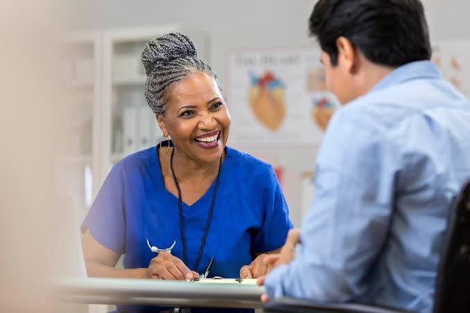 An AACO recruiter smiling during a call